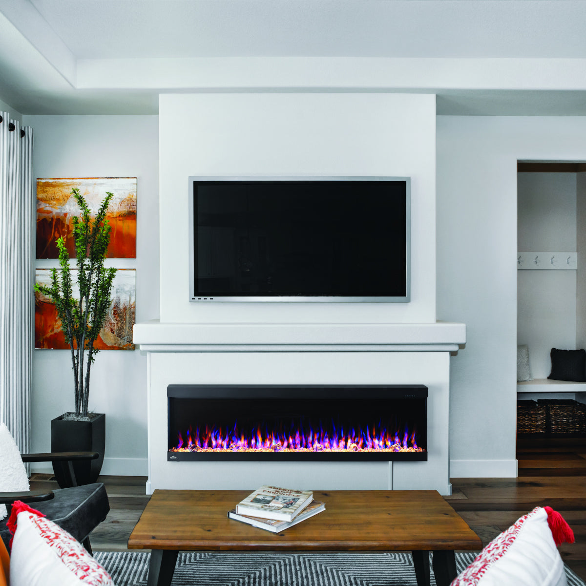 Napoleon Trivista Pictura 60" Wall-Mount Electric Fireplace NEFL60H-3SV with crystal media and mixed flames in living room