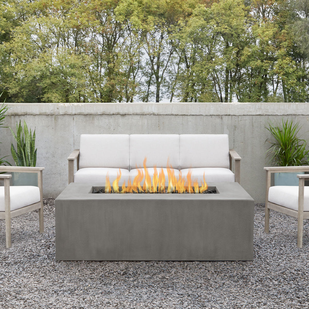 Real Flame Estes rectangle fire pit table with hidden propane tank in flint finish 142LP-FLNT in outdoor seating area