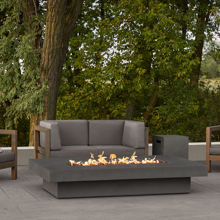 Real Flame Geneva 72" Rectangle Propane Fire Pit Table in outdoor seating area in carbon finish 1582LP-CBN